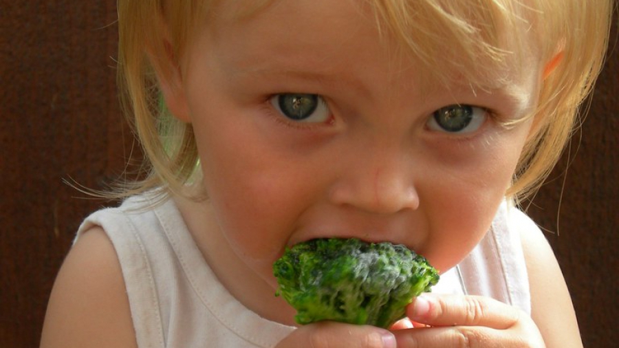 child eating broccoli july 20